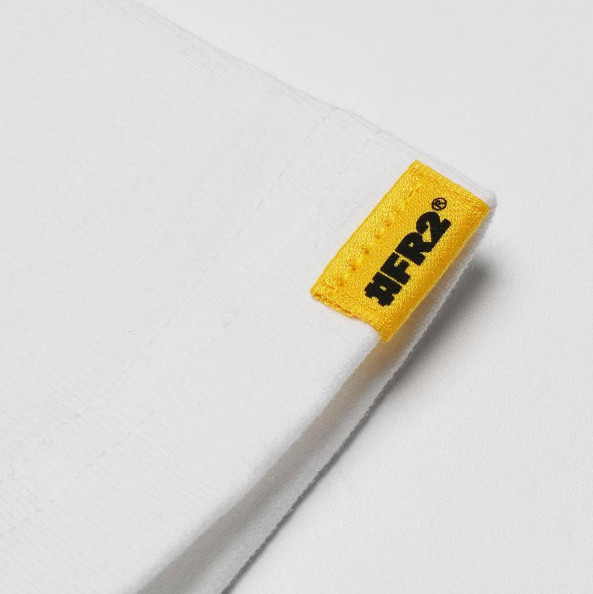 White FR2 Embroidery Smoking Art T-shirt featuring detailed embroidered design on the front, casual apparel by FR2.