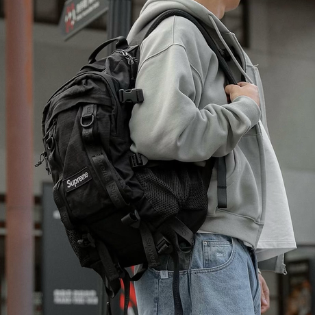 Black Supreme Box Logo backpack with front pocket and adjustable straps, featuring the iconic Supreme logo on the front.