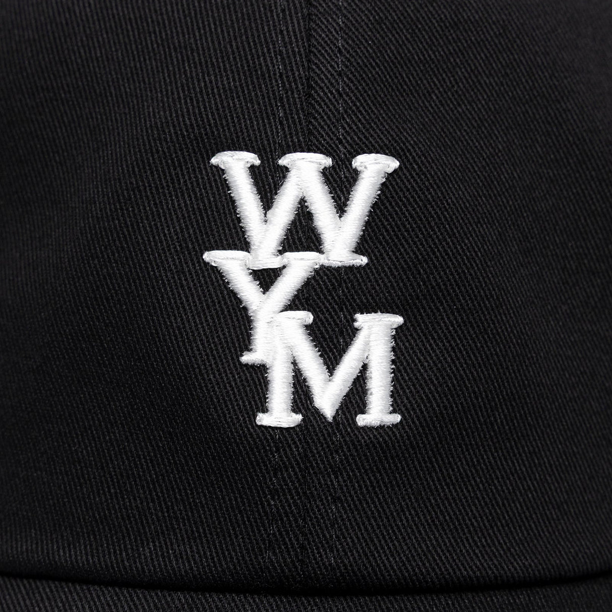 Black Wooyoungmi WYM logo cap, stylish headwear with embroidered branding and adjustable strap, made for casual and streetwear looks.