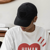 Human Made black 6-panel cap featuring the iconic heart logo, stylish headwear for casual and streetwear looks.