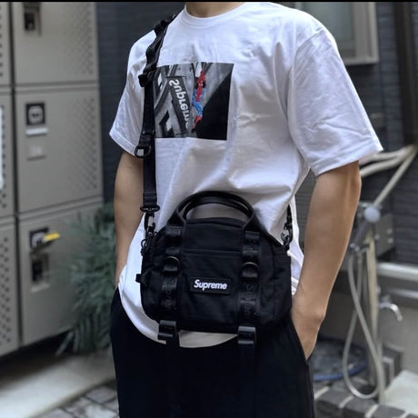 Supreme black box logo mini duffle bag with compact design and adjustable shoulder strap for carrying essentials.