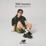 Black New Balance 9060 Mule sneakers with sleek design and cushioned sole, showcased from a side angle.