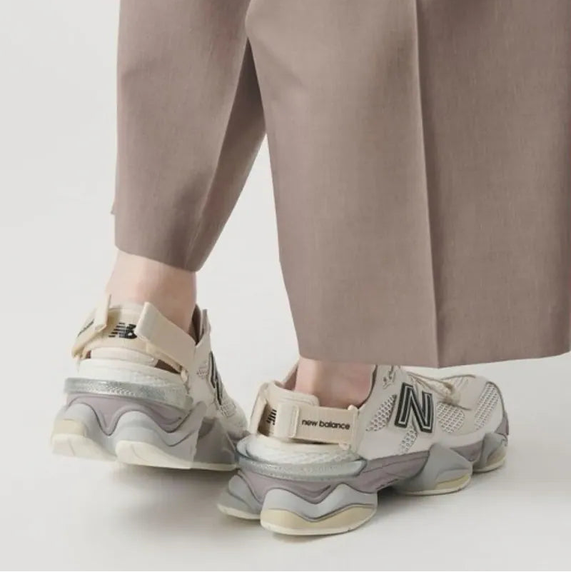 New Balance 9060 Mule sneakers in off-white and mauve with a sleek, modern design and comfortable fit.