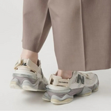 New Balance 9060 Mule sneakers in off-white and mauve with a sleek, modern design and comfortable fit.