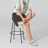New Balance 9060 Mule sneakers in off white and mauve with a sleek, modern design and comfortable fit.