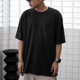 Stussy Stock Logo Tee in faded black, casual apparel with the iconic Stussy logo on the front.