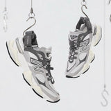 New Balance 9060 Mule Raincloud Castlerock sneakers with gray and white design, showcasing the stylish and comfortable footwear.