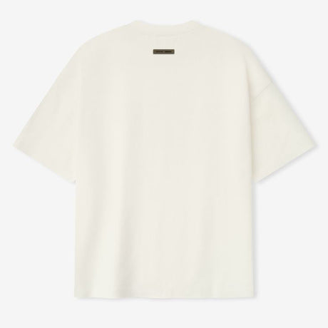 Fear of God Essentials reflective logo ivory 90s Ponte T-shirt, casual apparel with bold branding and comfortable fit.