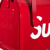 Supreme Gaines Mailbox apparel in red, featuring a bold mailbox graphic design on the front, casual streetwear style.
