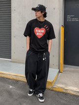 Human Made Red Heart Tee in black, casual T-shirt with red heart graphic, featuring a relaxed fit and soft fabric.