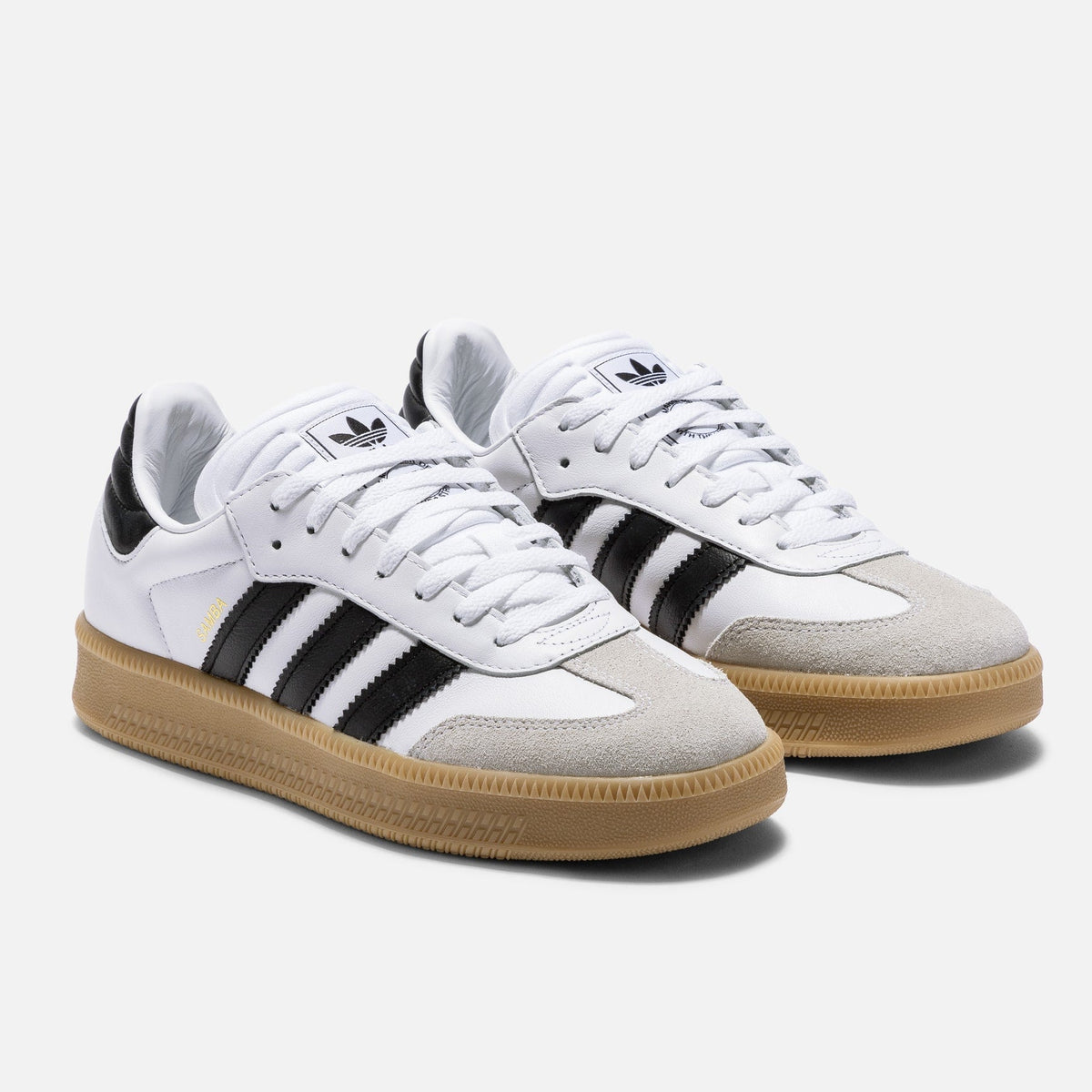 Adidas Originals Samba XLG sneakers in cloud white, core black, and gum sole, featuring classic lace-up design and leather upper.