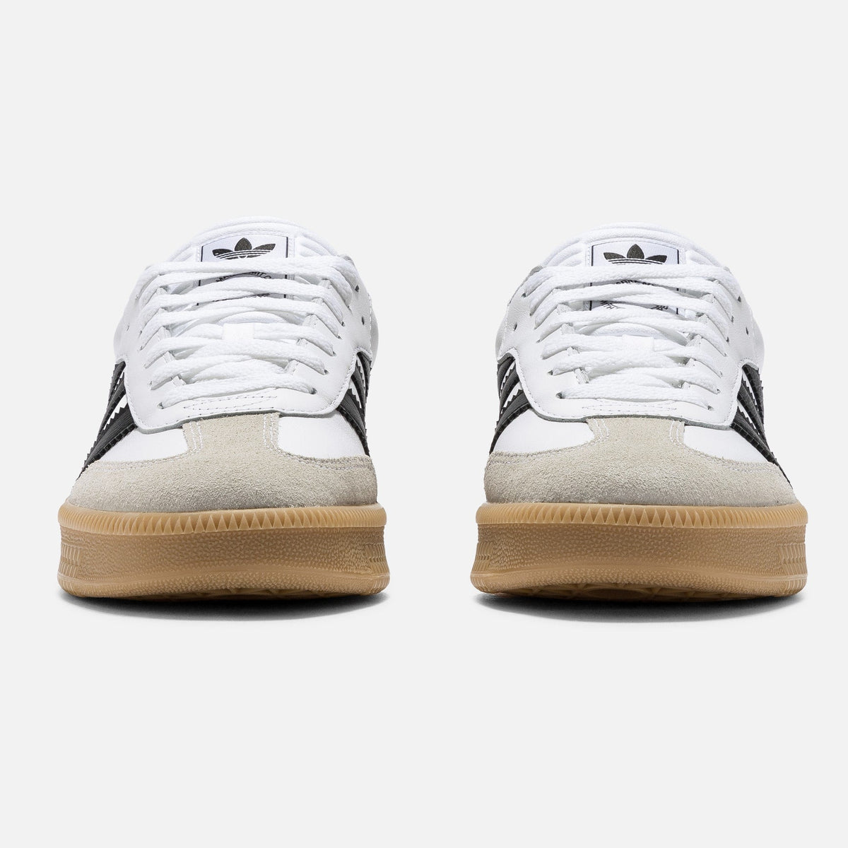 Adidas Originals Samba XLG sneakers in cloud white, core black, and gum sole with classic design and sporty style.