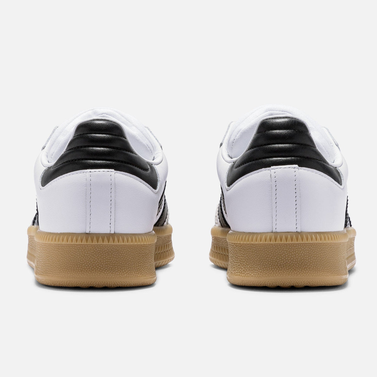Adidas Originals Samba XLG sneakers in Cloud White, Core Black, and Gum with classic low-top design and textured rubber sole.