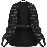 Supreme black reflective monogram logo backpack with silver logo and multiple compartments, stylish bags for everyday use.
