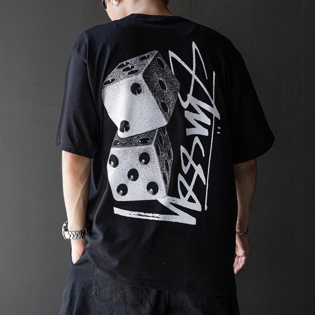 Stussy Tall Dice Tee in black, casual men's T-shirt with bold dice graphic on front, made by Stussy, apparel product image