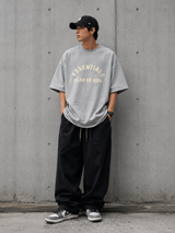 Fear of God Essentials heavyweight light heather T-shirt, casual apparel with a relaxed fit and soft fabric.