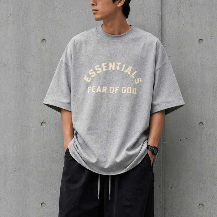 Fear of God Essentials Heavyweight Tee in Light Heather, unisex casual t-shirt with a relaxed fit and soft fabric.