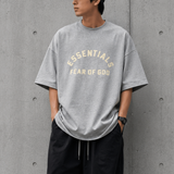 Fear of God Essentials Heavyweight Tee in Light Heather, unisex casual t-shirt with a relaxed fit and soft fabric.