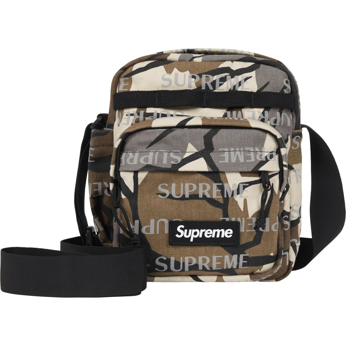 Supreme reflective monogram logo shoulder bag in predator camo with silver logo detail, featuring a sleek, modern design.