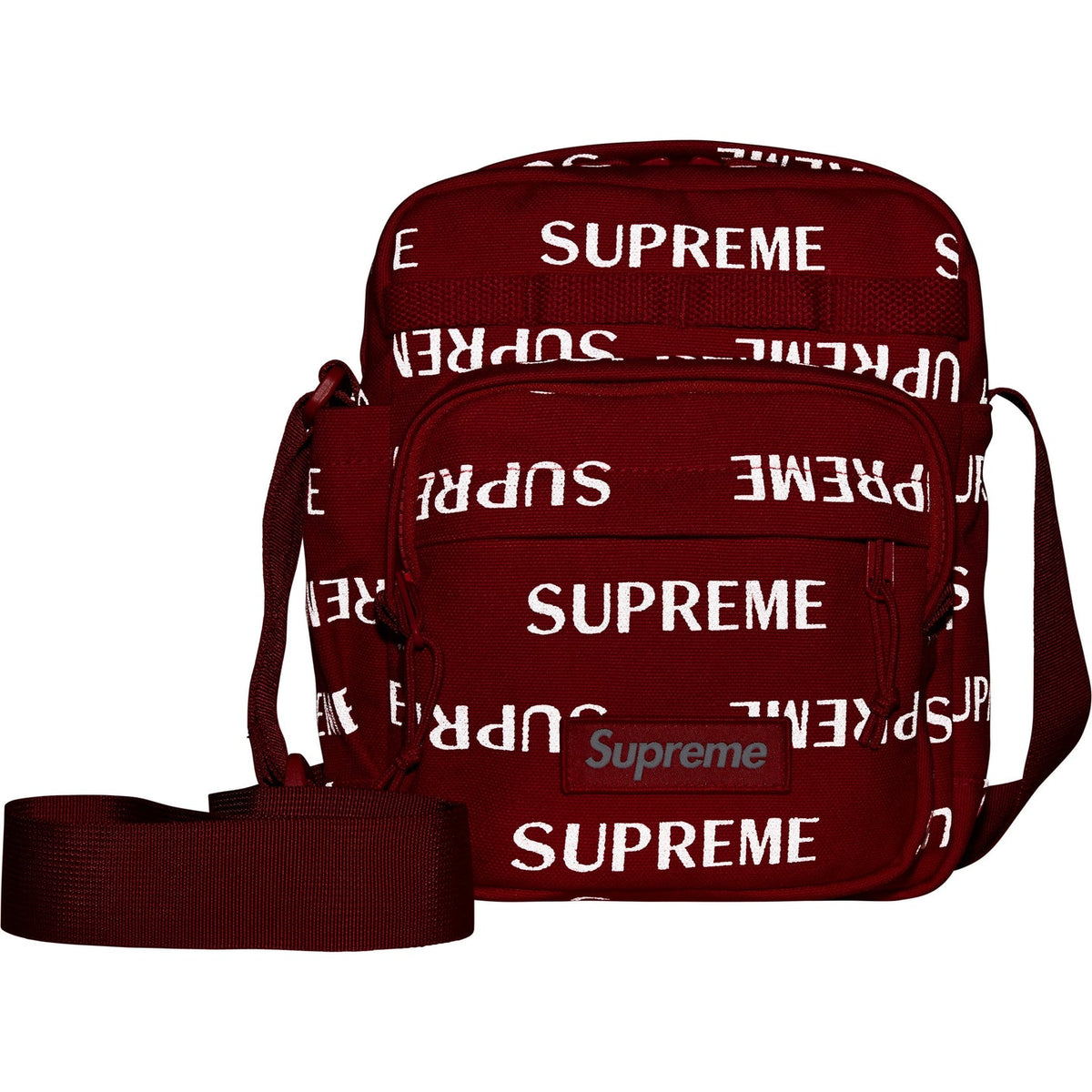 Supreme reflective monogram logo shoulder bag in red with silver logo detail, featuring a compact design and adjustable strap.