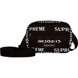 Supreme brown reflective mini shoulder bag with silver monogram logo, compact design, and adjustable strap.