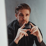 By Vilain Flow Pomade in a jar, showcasing its thick texture and natural finish, ideal for styling hair with a matte look.