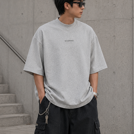 MasonPrince grey reflective oversized mock neck tee displayed on a hanger, showcasing its relaxed fit and high neckline.