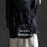 Human Made Black Military Mini Sling Bag showing adjustable strap and compact design for casual wear.