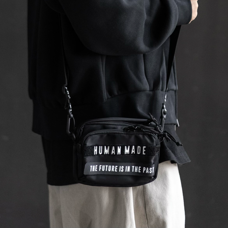 Human Made Black Military Mini Sling Bag showing adjustable strap and compact design for casual wear.