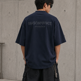 MasonPrince navy oversized mock neck tee with reflective details, casual apprel on a hanger, showcasing the relaxed fit and fabric texture.