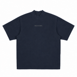 Navy MasonPrince Reflective Oversized Mock Neck Tee displayed on a hanger, highlighting its relaxed fit and reflective details.