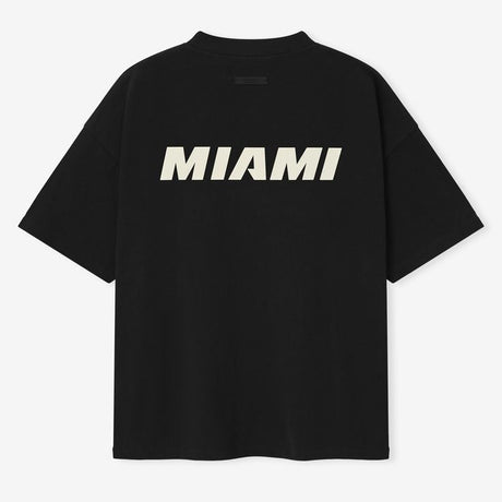 Fear of God Essentials NBA 90s Heavyweight Tee in black, featuring bold graphic design and comfortable heavyweight fabric.