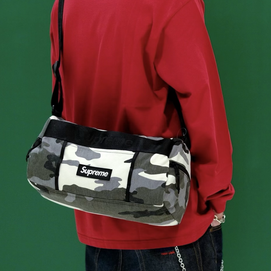 Supreme Utility Sling Bag in snow camo pattern, durable BAGS design with adjustable strap and multiple compartments.