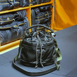 Porter Yoshida Japan Tanker 2-Way Tool Bag in black, durable fabric with multiple compartments and sturdy handles.