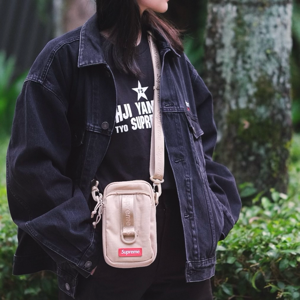Supreme tan box logo sling bag showing the branded logo, adjustable strap, and compact design for casual wear.