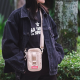 Supreme tan box logo sling bag showing the branded logo, adjustable strap, and compact design for casual wear.