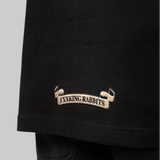 Black FR2 emblem icon T-shirt featuring a minimalist brand logo on the front, casual apparel for streetwear style.