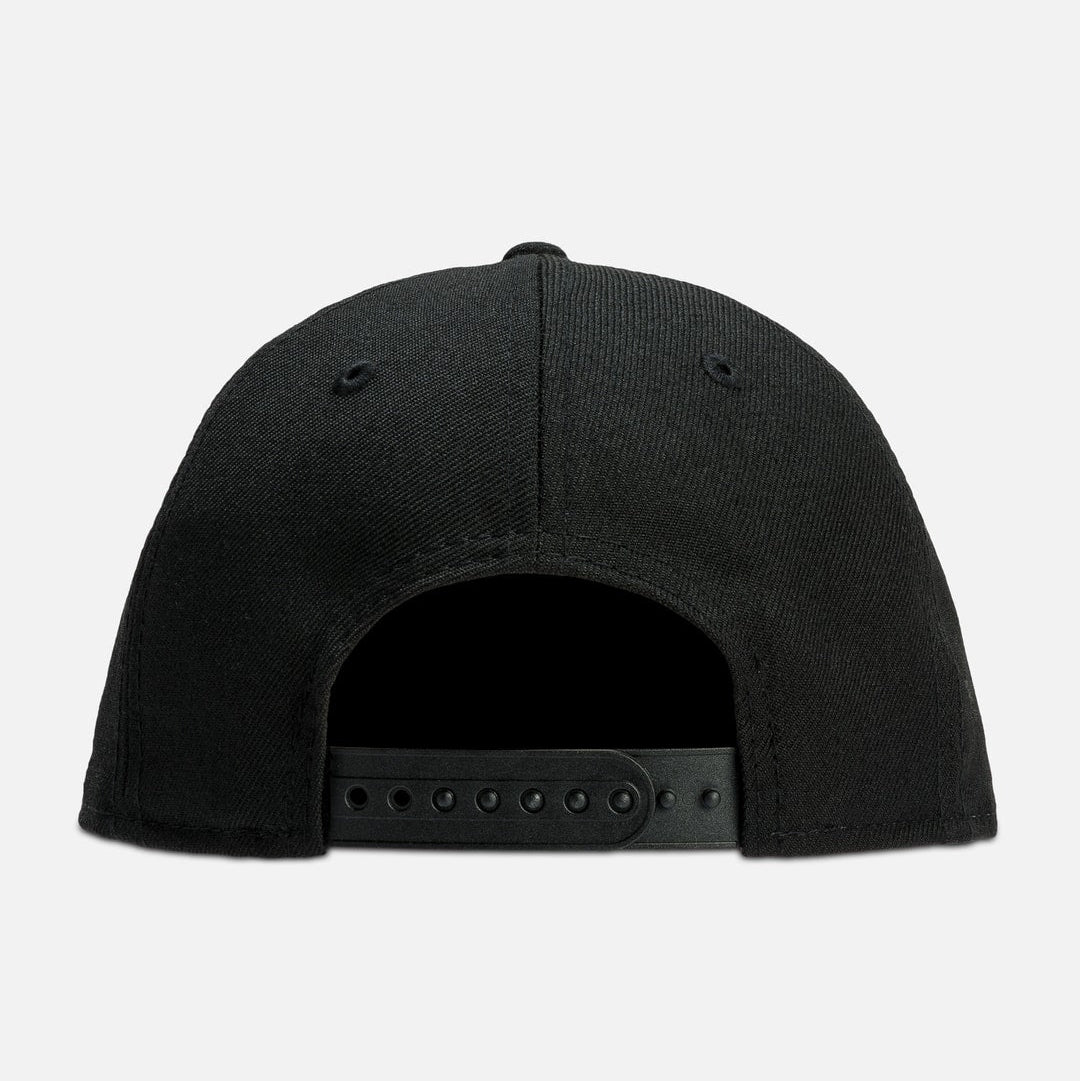 Fear of God Essentials NBA New Era 9FIFTY cap, black headwear with logo embroidery and adjustable strap.
