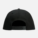Fear of God Essentials NBA New Era 9FIFTY cap, black headwear with logo embroidery and adjustable strap.