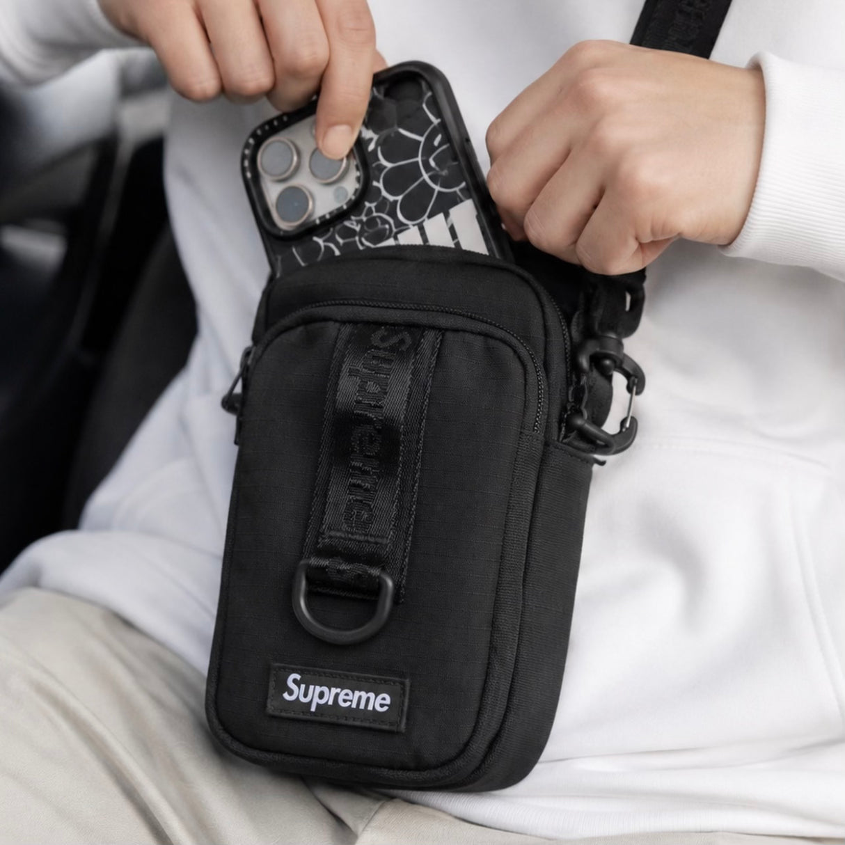 Supreme black box logo sling bag with adjustable strap and compact design, featuring the iconic Supreme branding.