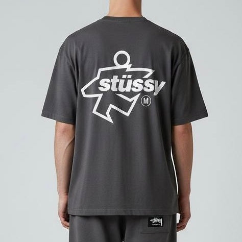 Black Stussy Surf Logo T-shirt showing the front with a surf-inspired logo graphic on the chest, casual apparel by Stussy.