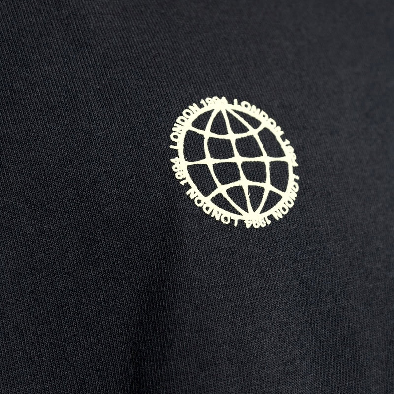 AllSaints Emblem Logo Tee in Washed Black, casual apparel with a front logo design, displayed on a flat surface.