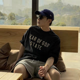 Fear of God Essentials 90's Tee Black