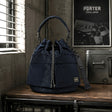 Porter Yoshida Japan Tanker 2-Way Tool Bag in navy, durable bag with multiple compartments and handles, designed for versatile use.