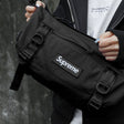 Supreme black box logo utility bag with adjustable strap, compact design, and multiple compartments for versatile storage.