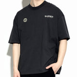 AllSaints washed black emblem logo tee, casual apparel with front logo design, shown on a plain background.