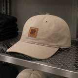 Undefeated Patch Logo Snapback hat in khaki, featuring a branded adjustable baseball cap with patch details and flat brim.