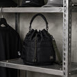Black Porter Yoshida Japan Tanker 2-Way Tool Bag with multiple compartments and sturdy handles, designed for versatile storage.