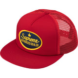 Red Supreme mesh trucker cap with adjustable snapback closure, featuring a breathable mesh back and iconic branding.