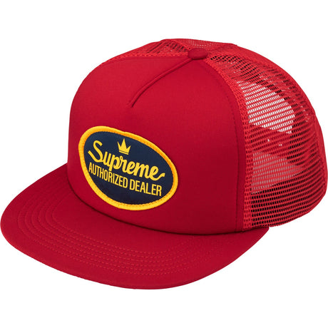 Red Supreme mesh trucker cap with adjustable snapback closure, featuring a breathable mesh back and iconic branding.